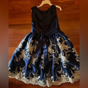 Biscotti, size 7, poofy skirt, navy blue with gold detail. Polyester